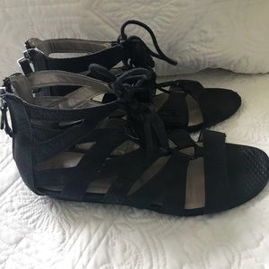 Black gladiator sandals w/ tassels